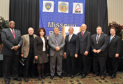 ARCHS' Chief Executive Officer Wendell E. Kimbrough with Department Directors for the State of Missouri at the 2010 Missouri Reentry Conference. From left are, Kimbrough, Keith Schafer (Department of Mental Health), Alana Barragan-Scott (Department of Revenue), George Lombardi (Department of Corrections), Gary Waint (Office of the State Courts Administrator), David Kerr (Department of Economic Development), Brian Kinkade (Department of Social Services) and Bill Dent (Manager for Family and Community Trust).